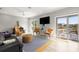 Living room with a large window leading to a deck with water views at 1827 Venetian Point Dr, Clearwater, FL 33755