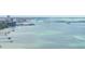 Stunning waterfront views overlooking the bay with bridge and city skyline in the distance on a clear and sunny day at 1827 Venetian Point Dr, Clearwater, FL 33755