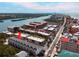 Inviting aerial view of condos with a pool near the beach and waterway, showcasing a coastal lifestyle at 19727 Gulf Blvd # 207, Indian Shores, FL 33785
