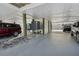 Spacious carport area featuring parking and AC units at 19727 Gulf Blvd # 207, Indian Shores, FL 33785