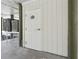 Exterior door to condo with AC unit visible; unit labeled 207/107 at 19727 Gulf Blvd # 207, Indian Shores, FL 33785