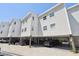 Charming condo complex featuring covered parking and architectural design, providing convenient and stylish coastal living at 19727 Gulf Blvd # 207, Indian Shores, FL 33785