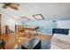 Bright game room with a foosball table, skylights, nautical themed wallpaper and a casual fun space at 19727 Gulf Blvd # 207, Indian Shores, FL 33785