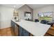 Open-concept kitchen with quartz countertops, stainless steel appliances, and stylish cabinetry, perfect for modern living at 19727 Gulf Blvd # 207, Indian Shores, FL 33785