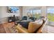 Cozy condo living room with stylish decor, comfortable seating, and access to a balcony with scenic views at 19727 Gulf Blvd # 207, Indian Shores, FL 33785