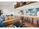 Inviting living space featuring an open concept kitchen, cozy seating, and a unique spiral staircase, creating a welcoming atmosphere at 19727 Gulf Blvd # 207, Indian Shores, FL 33785