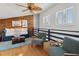 Cozy loft area featuring hardwood floors, ample seating, and stylish nautical decor for relaxation and entertainment at 19727 Gulf Blvd # 207, Indian Shores, FL 33785