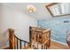 Charming nautical-themed loft with a spiral staircase and unique decor, showcasing a cozy and stylish design at 19727 Gulf Blvd # 207, Indian Shores, FL 33785