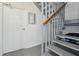 Interior staircase with gray-painted stairs and railing at 19727 Gulf Blvd # 207, Indian Shores, FL 33785