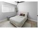Comfortable bedroom with a cozy bed, soft carpet, and a window that brings in natural light at 200 98Th Ne Ave, St Petersburg, FL 33702