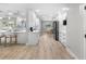 Bright, open kitchen with white cabinetry, stainless steel appliances, and a breakfast nook, ideal for modern living and entertaining at 200 98Th Ne Ave, St Petersburg, FL 33702
