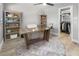 Bright office space features wood desk, bookshelves, and walk-in closet for efficient and stylish work at 200 98Th Ne Ave, St Petersburg, FL 33702