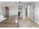 Spacious office area with a large desk, bookshelf, closet and easy access to the laundry room at 200 98Th Ne Ave, St Petersburg, FL 33702