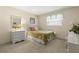 Calm bedroom with a bed, white dresser, and a window with natural light at 2029 Winding Oaks Dr, Palm Harbor, FL 34683
