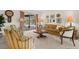 Inviting living room with sliding glass doors to backyard and stylish decor at 2029 Winding Oaks Dr, Palm Harbor, FL 34683