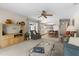 Cozy living room seamlessly connects to the kitchen, offering an open floor plan at 2029 Winding Oaks Dr, Palm Harbor, FL 34683