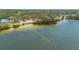 Aerial view of waterfront community with lush landscaping near the shore at 224 Ontario Ave, Crystal Beach, FL 34681