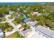 Aerial view of a residential property with mature trees and a convenient location near the water at 224 Ontario Ave, Crystal Beach, FL 34681