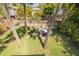 Aerial view of backyard with patio furniture and tropical landscaping at 224 Ontario Ave, Crystal Beach, FL 34681