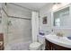 Bathroom featuring shower with a tile accent wall, toilet and vanity at 224 Ontario Ave, Crystal Beach, FL 34681