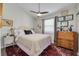 Cozy bedroom with a comfortable bed, area rug, and a vintage cabinet at 224 Ontario Ave, Crystal Beach, FL 34681