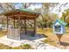 Cozy gazebo and book stand in a scenic waterfront community park at 224 Ontario Ave, Crystal Beach, FL 34681