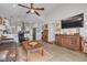Open living area with wood floors, art, and vaulted ceilings at 224 Ontario Ave, Crystal Beach, FL 34681