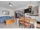 Open living area with dining space, a comfortable sofa, and access to additional storage at 224 Ontario Ave, Crystal Beach, FL 34681