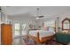 Comfortable main bedroom with a ceiling fan, exterior doors and a vintage rug at 224 Ontario Ave, Crystal Beach, FL 34681