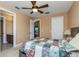 Bedroom view with ensuite bathroom and hallway views and a patterned quilt on the bed at 2630 Grand Lakeside Dr, Palm Harbor, FL 34684