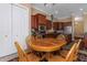 Open breakfast nook with views of the kitchen and a cozy dining area at 2630 Grand Lakeside Dr, Palm Harbor, FL 34684