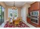 Cozy breakfast nook with a round table and natural light, adjacent to the kitchen at 2630 Grand Lakeside Dr, Palm Harbor, FL 34684