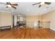 Bright loft area with hardwood floors and staircase with decorative railing at 2630 Grand Lakeside Dr, Palm Harbor, FL 34684