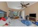 Spacious main bedroom with an en-suite bathroom and a cozy atmosphere at 2630 Grand Lakeside Dr, Palm Harbor, FL 34684