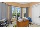 Cozy office space with natural light, desk, and outdoor views at 2630 Grand Lakeside Dr, Palm Harbor, FL 34684