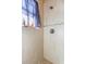 Tiled walk-in shower with glass door and mosaic accent tiles; features updated shower fixture at 2630 Grand Lakeside Dr, Palm Harbor, FL 34684