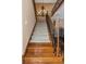 Carpeted staircase with elegant iron railing and wood accents leading to the upper level at 2630 Grand Lakeside Dr, Palm Harbor, FL 34684