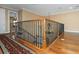 View of the staircase with wooden banister and an elegant chandelier hanging above at 2630 Grand Lakeside Dr, Palm Harbor, FL 34684