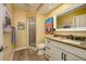 Bathroom with granite countertops, and a large mirror at 29844 Baywood Ln, Wesley Chapel, FL 33543