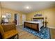 Bedroom with blue rug and wood furniture at 29844 Baywood Ln, Wesley Chapel, FL 33543