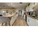 Bright kitchen with granite countertops, stainless steel appliances and island with seating at 29844 Baywood Ln, Wesley Chapel, FL 33543