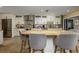 Beautiful kitchen featuring white cabinets, granite countertops, and a breakfast bar with seating at 29844 Baywood Ln, Wesley Chapel, FL 33543