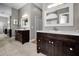 Spacious bathroom with double vanities, mirrors, and neutral tiling at 2997 Eagle Estates E Cir, Clearwater, FL 33761