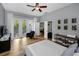 Bright bedroom with hardwood floors, balcony access, and ample closet space at 2997 Eagle Estates E Cir, Clearwater, FL 33761