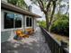 Outdoor deck with furniture, railing and view of backyard greenery at 2997 Eagle Estates E Cir, Clearwater, FL 33761