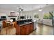 Open kitchen with stainless steel appliances, granite countertops, and a view of the living room at 2997 Eagle Estates E Cir, Clearwater, FL 33761