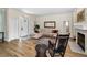 Comfortable living area with hardwood floors, plush couch, and fireplace at 2997 Eagle Estates E Cir, Clearwater, FL 33761