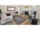 Open-concept living area with fireplace, hardwood floors, and comfortable seating at 2997 Eagle Estates E Cir, Clearwater, FL 33761