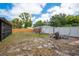 Large backyard with firepit and swing set, perfect for outdoor activities at 333 Acropolis Dr, Dunedin, FL 34698
