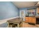 Functional kitchen with a wooden table and bench seating, plus a convenient sink and ample counter space at 333 Acropolis Dr, Dunedin, FL 34698